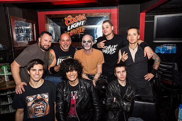 Michale Graves band, with Music Lynxx owner in background, members of The Scarecrow Show in front.